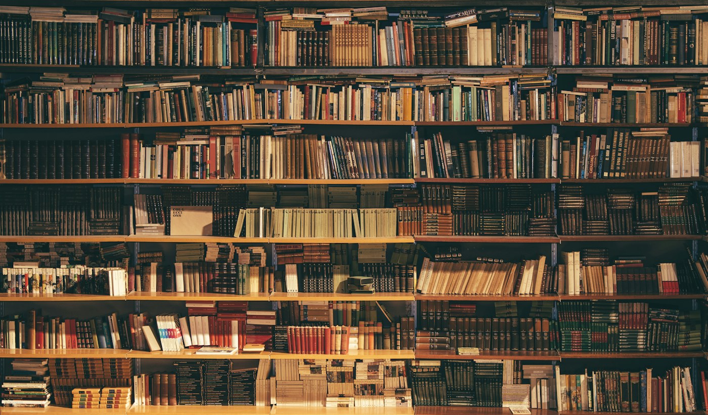 Illustrative stock photograph of a library lined with bookshelves