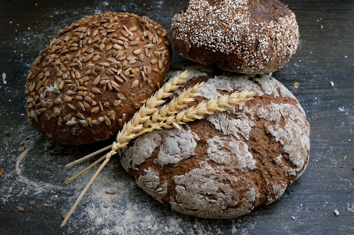 Freshly baked loaves cooling on a bakery table